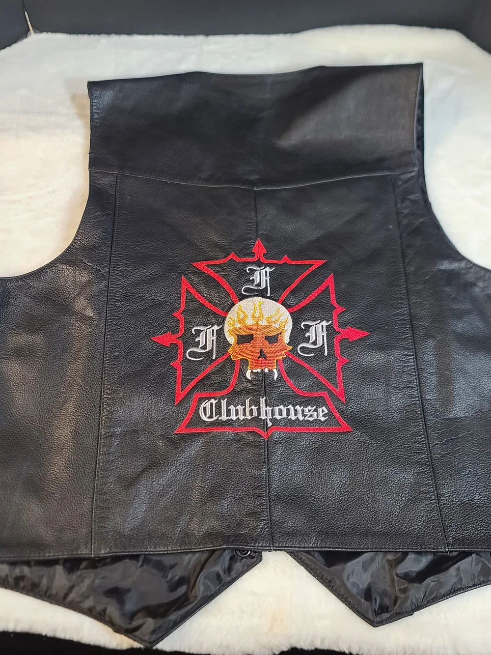 Black Leather Clubhouse Vest with Red & Orange Skull Emblem